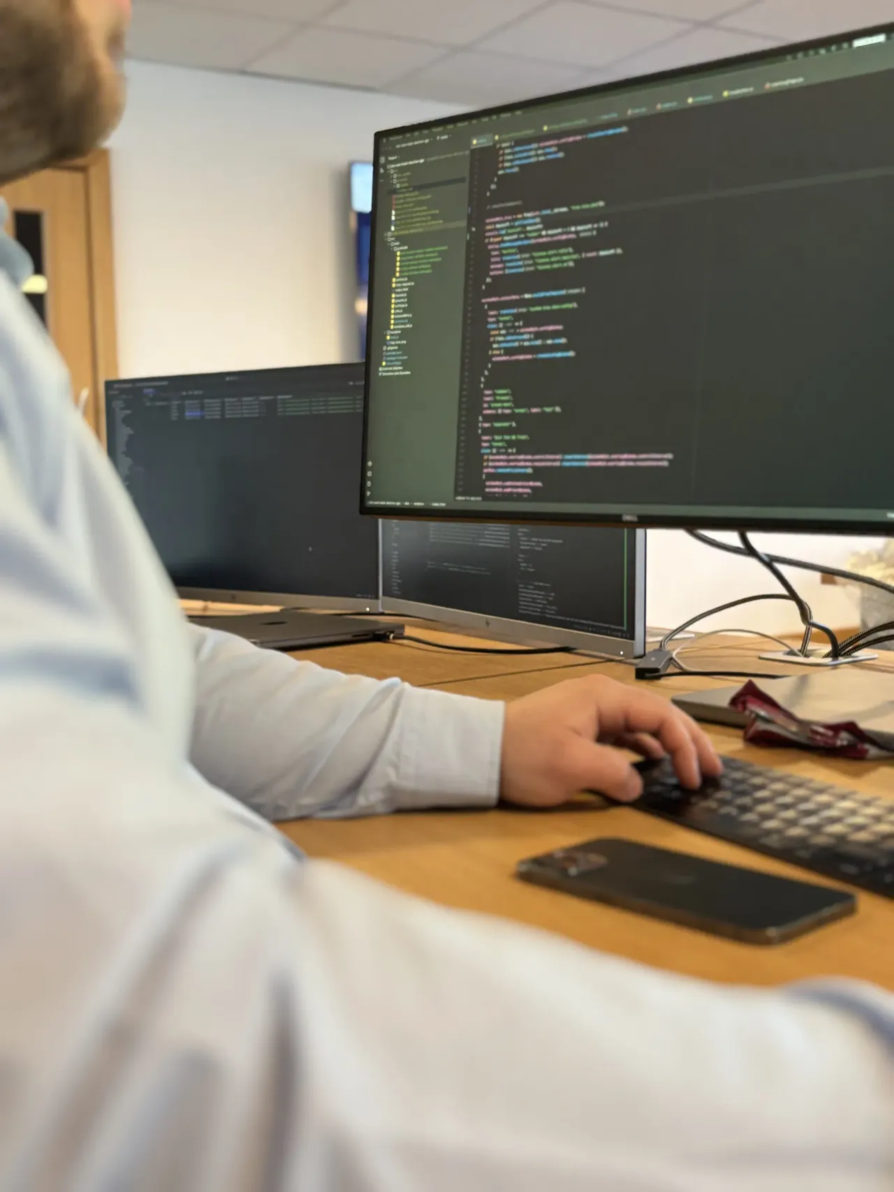 A developer at a workstation building a custom application.